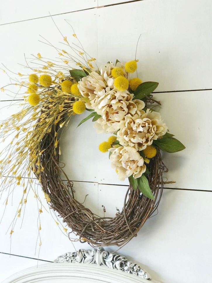 fall grapevine wreath with yellow and white flowers